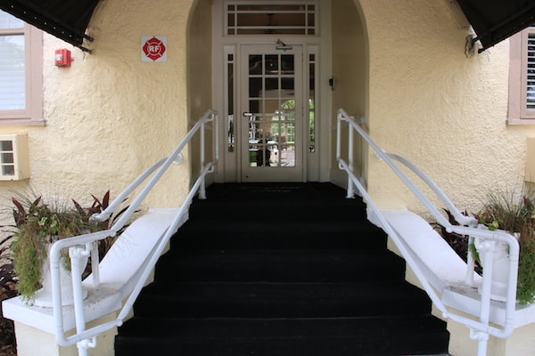 Stairway entrance with support rails